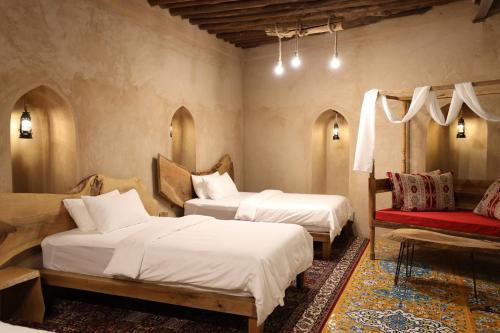 A bed or beds in a room at Beit Al Fateh بيت الفتح