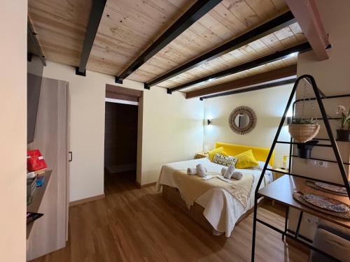 a bedroom with a bed and a wooden ceiling at Studio 2 Port Valencia in Valencia