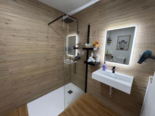 a bathroom with a sink and a shower at Studio 2 Port Valencia in Valencia