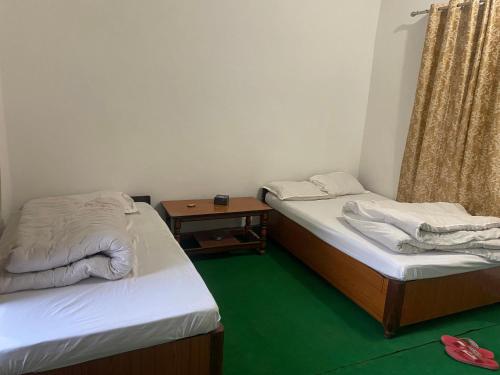 Postel nebo postele na pokoji v ubytování Hotel Bajhang