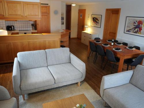 a living room with a couch and a table at Apartment Le Miclivier B1 by Interhome in Villars-sur-Ollon