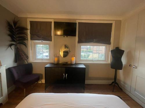 Postel nebo postele na pokoji v ubytování The Little Boutique House