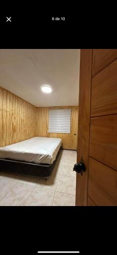 Ένα ή περισσότερα κρεβάτια σε δωμάτιο στο Cabaña pucura