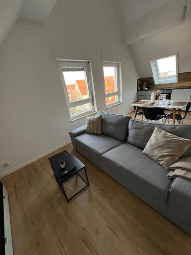a living room with a couch and a table at Ferienwohnung Maichingen in Sindelfingen