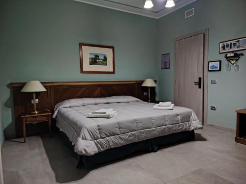 Ένα ή περισσότερα κρεβάτια σε δωμάτιο στο Villa Mariana Bed and Breakfast