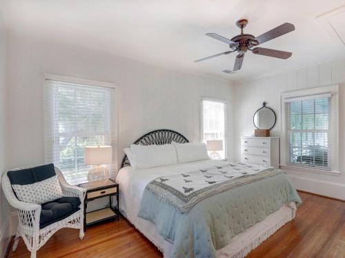 a bedroom with a bed and a ceiling fan at Elsewhere on Tybee in Tybee Island