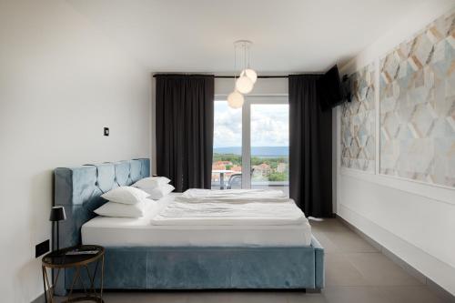 En eller flere senge i et værelse på Villa Lavinia