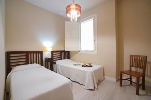 Postel nebo postele na pokoji v ubytování Casa Palacio de Cadiz