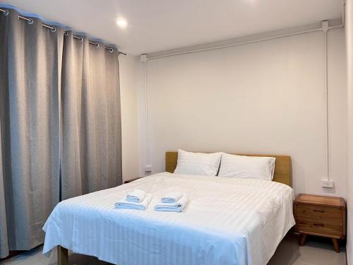 Voodi või voodid majutusasutuse บ้านแม่เกสต์เฮ้าส์ Bann Mae toas