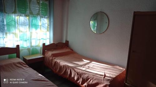 Ένα ή περισσότερα κρεβάτια σε δωμάτιο στο Chalet San Bernardo 6 personas a 4 del Mar 3 del centro