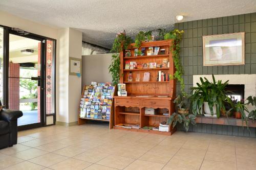 a store lobby with a shelf with products on it at Canadas Best Value Inn Kelowna in Kelowna