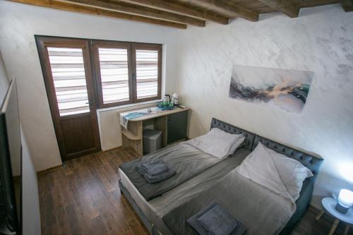 Ένα ή περισσότερα κρεβάτια σε δωμάτιο στο Guest House Fortuna