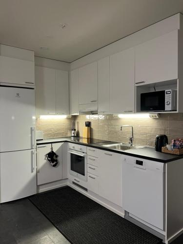 Η κουζίνα ή μικρή κουζίνα στο Aurora Chalet with Sauna