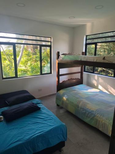 Ένα ή περισσότερα κρεβάτια σε δωμάτιο στο Melgar ANGEL 5