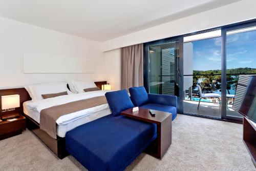 Posteľ alebo postele v izbe v ubytovaní Hotel Parentium Plava Laguna