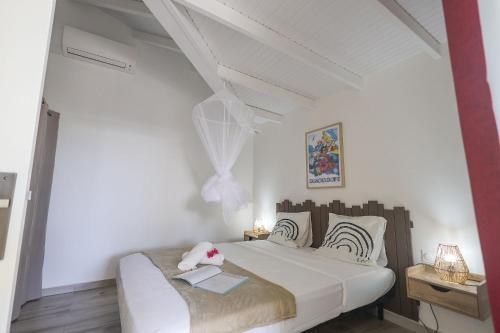 Ένα ή περισσότερα κρεβάτια σε δωμάτιο στο L'Escapade Créole