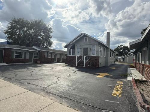 a house is parked in a parking lot at Rollie's Motel Daytona Beach by Hotel O in Holly Hill