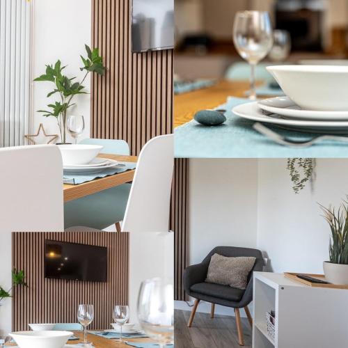 a table with plates and glasses and a chair at Briants, for Families & Contractors - Free Parking in Reading