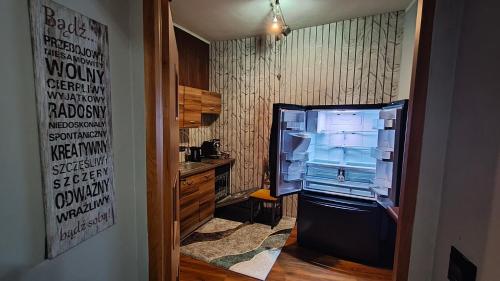 TV a/nebo společenská místnost v ubytování TRZY SOWY noclegi Bytom 24h meldunek samodzielny wygodnelokumpl