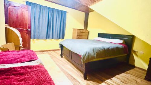 En eller flere senge i et værelse på Baños-Cuenca