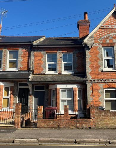 a brick house with a front porch and a porch at Stylish Caversham Town-House Free Parking & Garden in Caversham