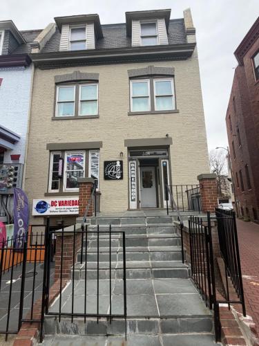a house with a gate in front of it at Pleasant Rooming House in Washington, D.C.