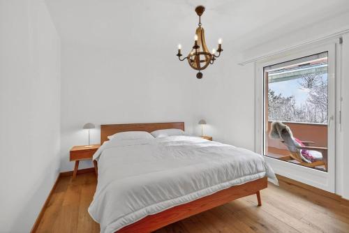 Ένα ή περισσότερα κρεβάτια σε δωμάτιο στο Emotional House in St Moritz Cresta BoB