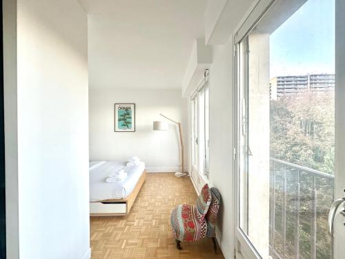 Ένα ή περισσότερα κρεβάτια σε δωμάτιο στο Le Feudon - Grand 2 pièces avec balcon et parking privé