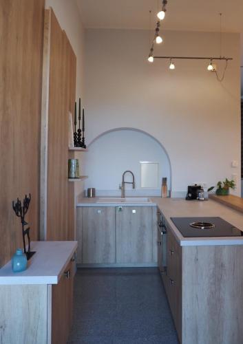 a large kitchen with a sink and a counter at Ein Traum im Turm, historischer Wasserturm Worms in Worms