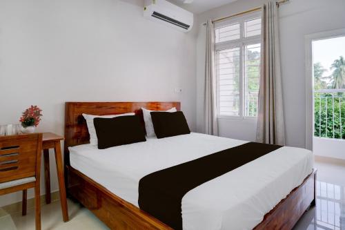 Ένα ή περισσότερα κρεβάτια σε δωμάτιο στο Hotel O La Vita Oasis