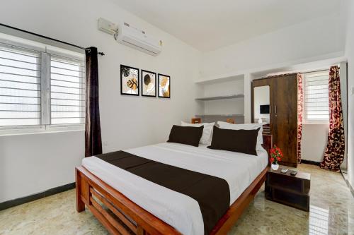 Voodi või voodid majutusasutuse Hotel O Muthalipalayam Bus Stand Coimbatore Formerly Haven Stays toas