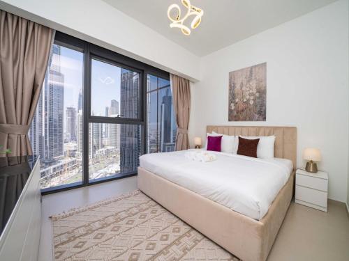Ένα ή περισσότερα κρεβάτια σε δωμάτιο στο Stunning 2 bed dubai mall burj khalifa downtown ACT 1