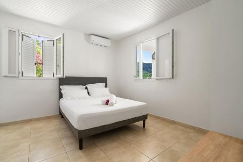 Ένα ή περισσότερα κρεβάτια σε δωμάτιο στο Villa Blanc de blanc