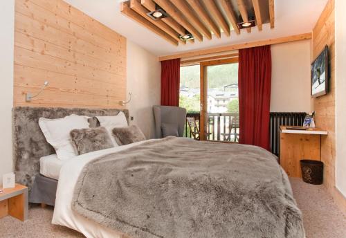 Ένα ή περισσότερα κρεβάτια σε δωμάτιο στο Park Hotel Suisse & Spa