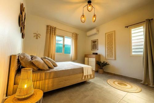 En eller flere senge i et værelse på Villa Docéa