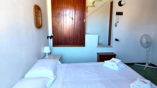 Ένα ή περισσότερα κρεβάτια σε δωμάτιο στο Lerici - Il Terrazzino Di Zia