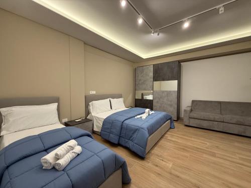 Ένα ή περισσότερα κρεβάτια σε δωμάτιο στο The Villas