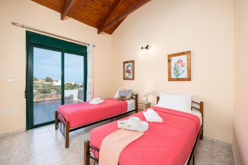 Ένα ή περισσότερα κρεβάτια σε δωμάτιο στο Villa Phedra