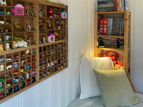 a childs room with a chair and toys at Family Cabin With Fjord Views In Drøbak Heights in Drøbak