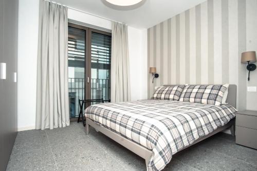 Giường trong phòng chung tại Milano Boutique Suite - Luxury & Wellness