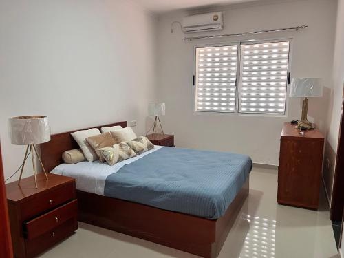 Ένα ή περισσότερα κρεβάτια σε δωμάτιο στο AGT Condo Home