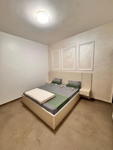 Ένα ή περισσότερα κρεβάτια σε δωμάτιο στο COZy APPARTE