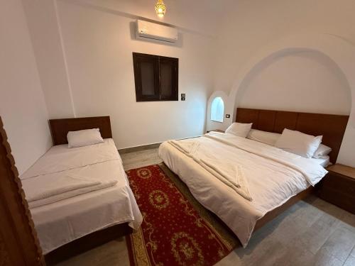 Ένα ή περισσότερα κρεβάτια σε δωμάτιο στο Bab Al Shams Palace