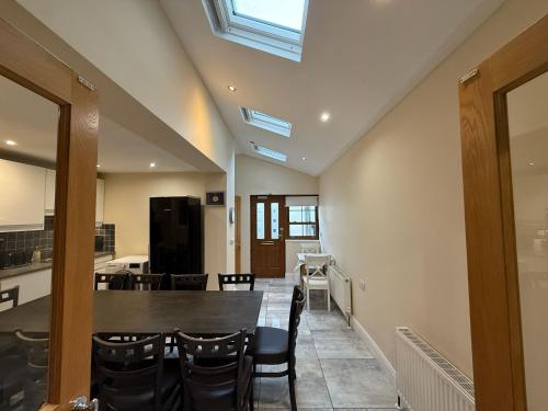 a dining room with a table and chairs at The Townlets Townhouse - 5BR - sleeps 13 in Belfast