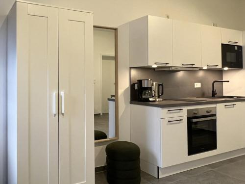 Η κουζίνα ή μικρή κουζίνα στο Business Apartments - Hof Wanstrath - select2stay