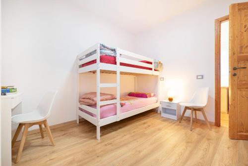 Postel nebo postele na pokoji v ubytování Casa Vacanze Cá Andriöi