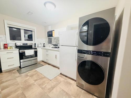 a kitchen with a refrigerator and a microwave at Point Peel Haven Retreat in Leamington
