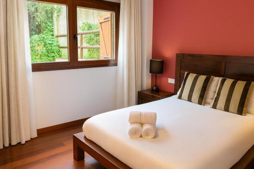 En eller flere senge i et værelse på Vall Fosca - Apartamento con espectaculares vistas y jardín privado