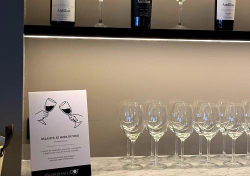 een stel wijnglazen op een plank bij Hotel Palermitano by DOT Boutique in Buenos Aires