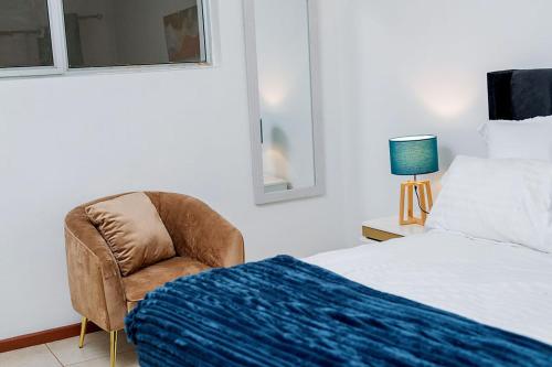 Un pat sau paturi într-o cameră la Avondale Villa